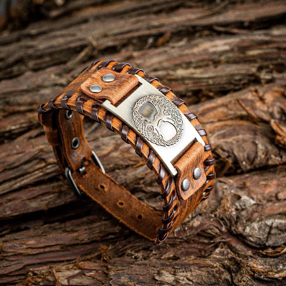 https://norsespirit.com/cdn/shop/products/leather-buckle-arm-cuff-with-metal-tree-of-life-yggdrasil-design-425_1200x.jpg?v=1658849411
